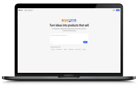 Atoms website displayed on a Macbook