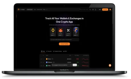 CoinStats website displayed on a Macbook