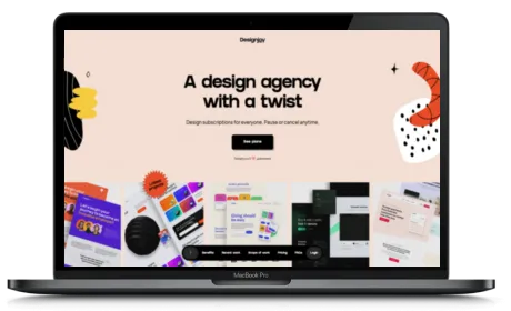 DesignJoy website displayed on a Macbook