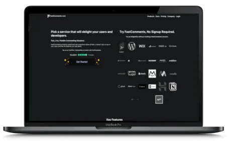 FastComments website displayed on a Macbook