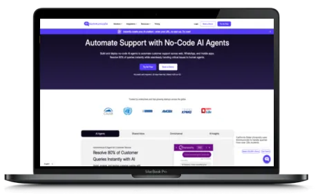 Kommunicate website displayed on a Macbook
