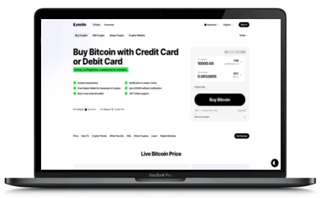 Paybis website displayed on a Macbook