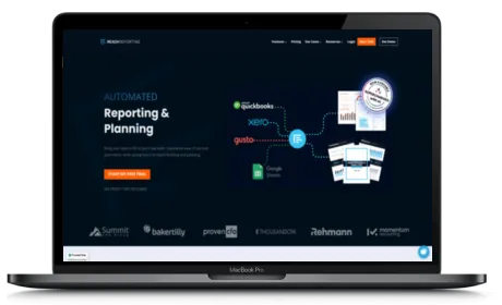 Reach Reporting website displayed on a Macbook