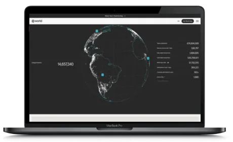 Worldcoin website displayed on a Macbook